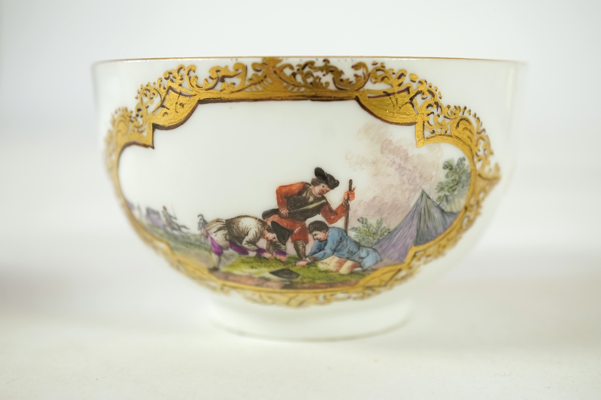 A Meissen cup and saucer, similar tea bowl and two saucers, c.1735-45